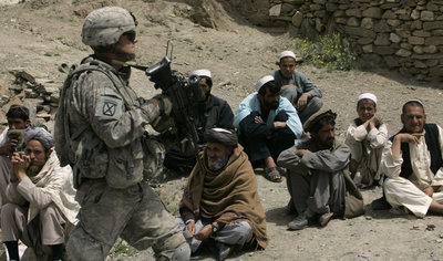 US military and Afghan civilians (photo: AP)
