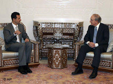 George Mitchell and Bashar al-Assad (photo: AP)