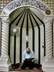 A man praying in a mosque (photo: AP)