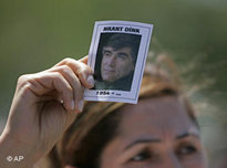A demonstrator holds up a picture of Hrant Dink (photo: AP)