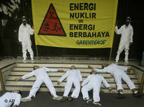 Greenpeace activists perform die-in protest during an anti-nuclear demonstration in Jakarta (photo: AP)