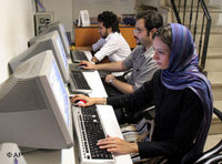 Iranians work at an internet cafe in Tehran, 8 August 2006 (photo: AP)