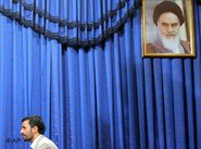 Iran's President Mahmoud Ahmadinejad, eyed on by Revolutionary Leader Khomeini (photo: AP)
