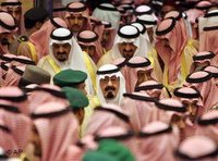 Saudi King Abdullah bin Abd al-Aziz, center, is surrounded by hundreds of Islamic clerics, tribal chiefs and other prominent Saudis before he receives oaths of loyalty in a traditional Islamic investiture ceremony that bestows his legitimacy (photo: AP)