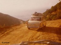 Car drivign down a road at the seaside, late 1960s (photo: presse)