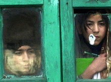 Kashmiri children watch a protest through a window in Srinagar, February 2007 (photo: AP)