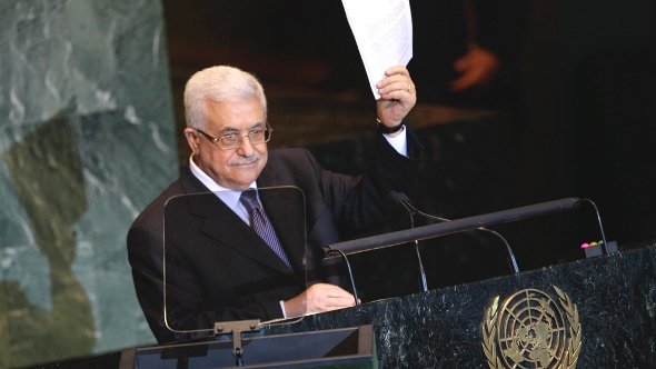 Palestinian President Mahmoud Abbas holds a letter requesting recognition of Palestine as a state as he addresses the 66th session of the United Nations General Assembly, Friday, Sept. 23, 2011 at UN Headquarters (photo: Reuters)