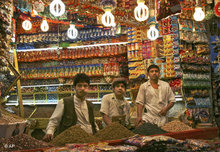 Three Yemeni men at a spiece stand (photo: AP)