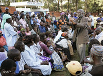 Displaced Kenyans discuss their fate in the International Trade Fair at Jamhuri Park, Nairobi, where many displaced Kenyans have been living (photo: AP) 