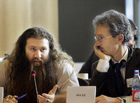 Murat Kurnaz, left, ex-detainee from Guantanamo, addresses the 'Temporary Committee on the alleged use of European Countries by the CIA for the Transport and Illegal Detention of Prisoners' at the European Parliament in Brussels as his lawyer looks at him, 22 November 2006 