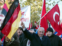 Turkish nationals living in Germany wave Turkish and German flags (photo: AP)