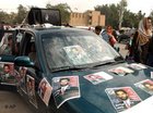 سيارة مزينة بملصقات انتخابية، الصورة: أ ب
