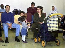 Migrant family in a naturalization office in Hamburg, Germany (photo: AP)