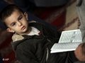 صبي يقرأ القرآن في جامع لندن، الصورة: أ ب