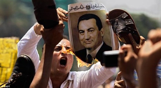  Outright rage: Man burns a portrait of former Egyptian President Mubarak