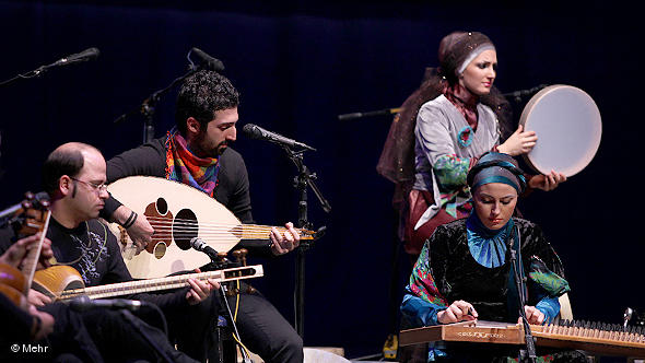 Musicians in a group playing traditional Iranian music