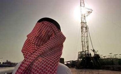 Saudi man in traditional garb at an oil site (photo: AP)