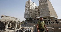 Destroyed buildings in front of the Iraqi Ministry of Finanance (photo: AP)