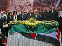 Mahmoud Abbas (centre) at Darwish's funeral ceremony (photo: AP)