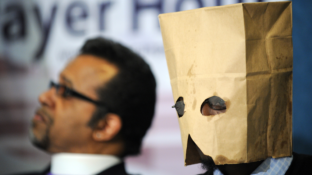A gay Ugandan man seeking asylum in the US hides his face with a hood at a press conference in Washington DC, February 2010 (photo: Jewel Samad/AFP/Getty Images)