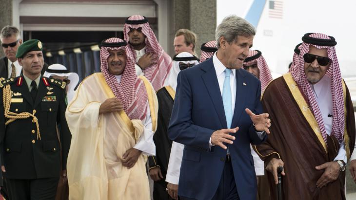 US Secretary of State John Kerry (second right) speaking to the Saudi Foreign Minister HRH Saud al-Faisal (photo: AFP/Getty Images/Brendan Smialowski)