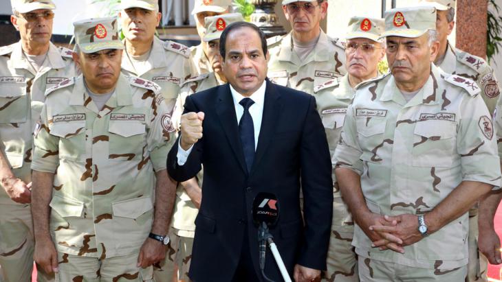 Abdul Fattah al-Sisi surrounded by senior members of the military (photo: Reuters/The Egyptian presidency)