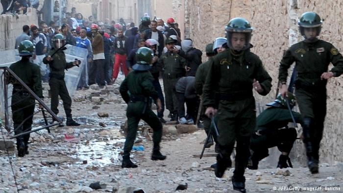 Police during a riot in Algeria (photo: AFP/Getty Images/F. Batiche)