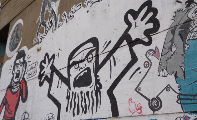 The Ikhwan portrayed as a frightening figure, graffiti on Mohamed Mahmoud St, Cairo (photo: Arian Fariborz)