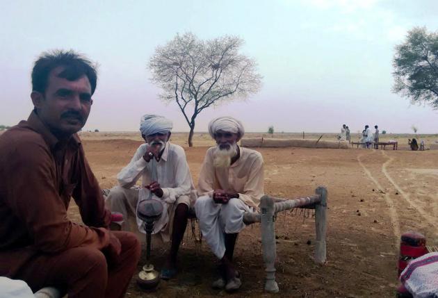 Men sitting on a charpoy, Cholistan desert, Pakistan (photo: Usman Mahar)