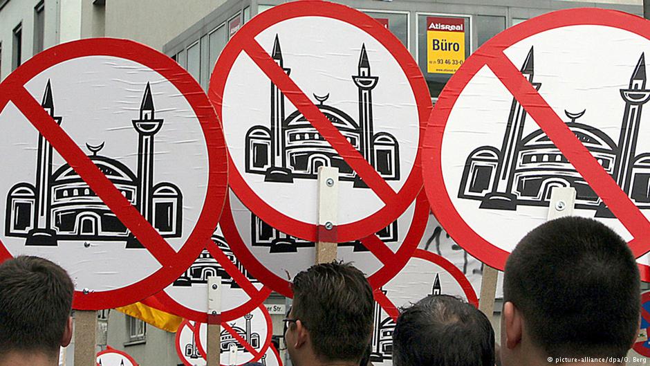 Right-wing populists bearing anti-mosque banners in Cologne