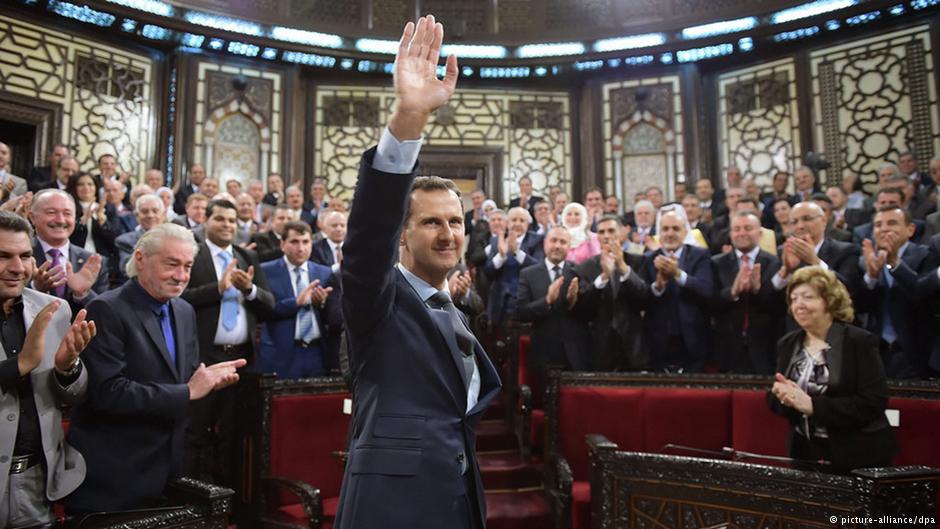 Assad surrounded by supporters in the Syrian parliament, summer 2016