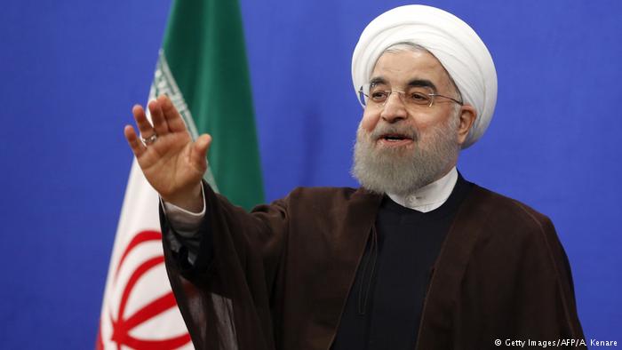 Iranian President Rouhani gestures during a televised speech