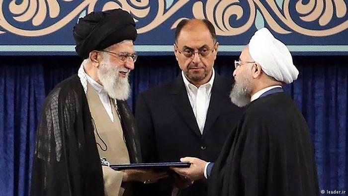 Iran's supreme leader, Ayatollah Ali Khamenei (left) formally endorses President Rouhani (right) for a second term in office