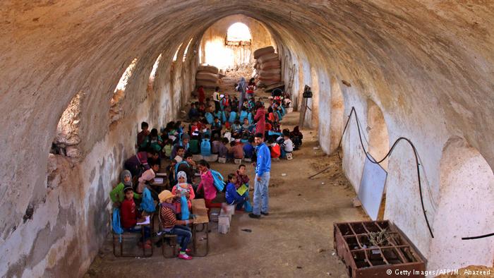 Children study in a barn in Syria (photo: Getty Images/AFP/M. Abazeed)