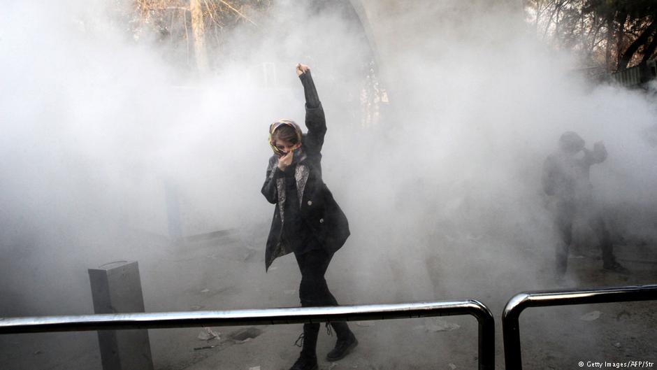 A protester raises a fist in defiance in a cloud of tear gas (photo: Getty Images/AFP/STR)