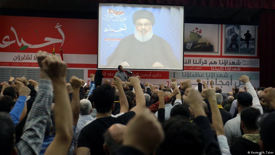 Lebanon's Hezbollah leader Sayyed Hassan Nasrallah is seen on a video screen as he addresses his supporters in Beirut, 10 November 2017 (photo: Reuters/Aziz Taher)