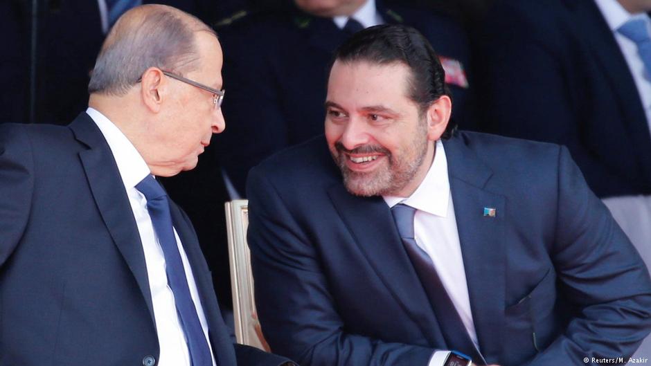 Saad Hariri, who announced his resignation as Lebanon's prime minister from Saudi Arabia reacts as he talks with Lebanese President Michel Aoun while attending a military parade to celebrate the 74th anniversary of Lebanon's independence in downtown Beirut, Lebanon 22 November 2017 (photo: Reuters/Mohamed Azakir)