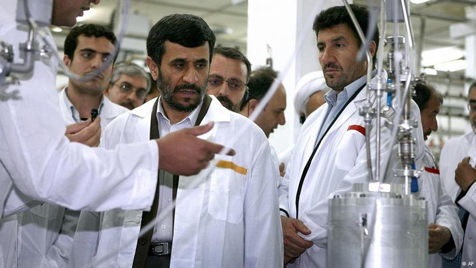 Former Iranian President Mahmoud Ahmadinejad, centre, listens to a technician during his visit to the Natanz Uranium Enrichment Facility some 322 kilometres south of the Iranian capital Tehran on April 8, 2008 (photo: AP)