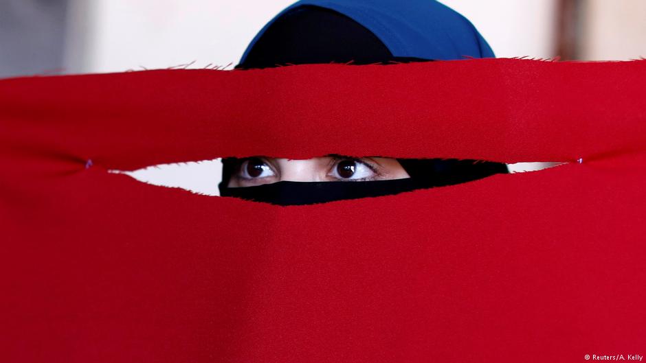 Alaa, 21, a student of health and nutrition, born in Copenhagen and wearer of the niqab, tests a face veil she created with members of the group Kvinder I Dialog (Women In Dialogue) during a workshop in preparation for the August 1 protest against the face veil ban in Copenhagen, Denmark (photo: Reuters/Andrew Kelly)