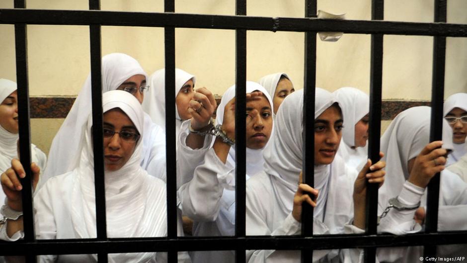 Female members of the Muslim Brotherhood are seen during their trial in the Egyptian city of Alexandria on 27 November 2013. A court in the Mediterranean city sentenced 14 women whom it said were from the Brotherhood after convicting them of belonging to a 'terrorist organisation,' judicial sources said (photo: Getty Images/AFP)