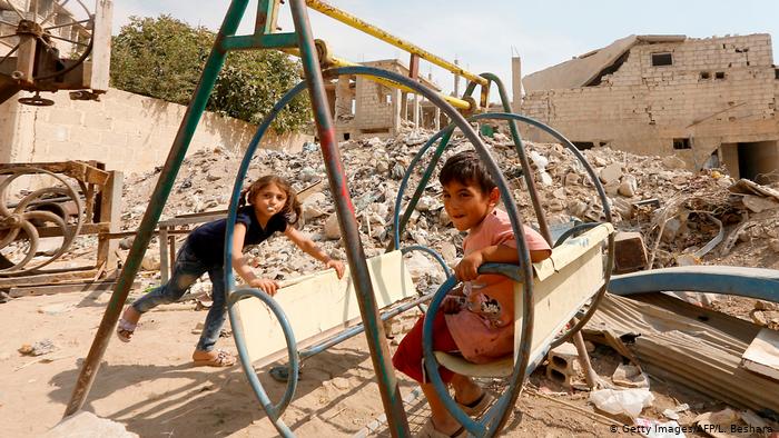 Children at play in Zabdin, Ghouta, Syria (photo: Getty Images/AFP/L. Beshara)