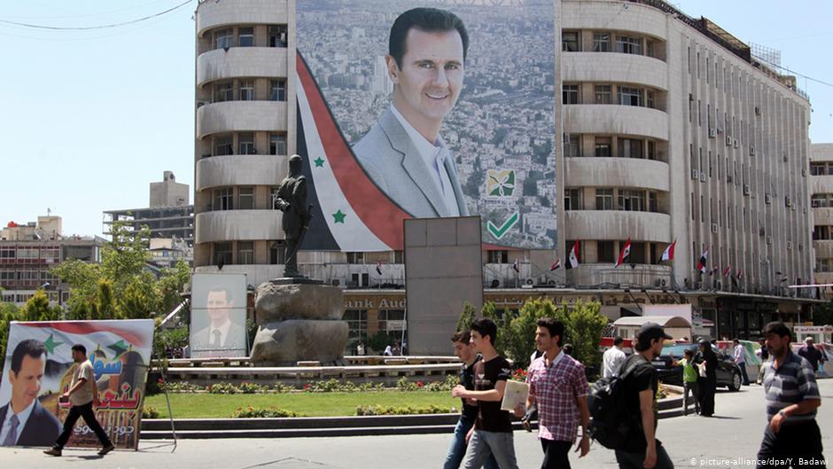 Porträt von Baschar al-Assad auf dem Al-Mohafazah-Platz in Damaskus; Foto: dpa/picture-alliance