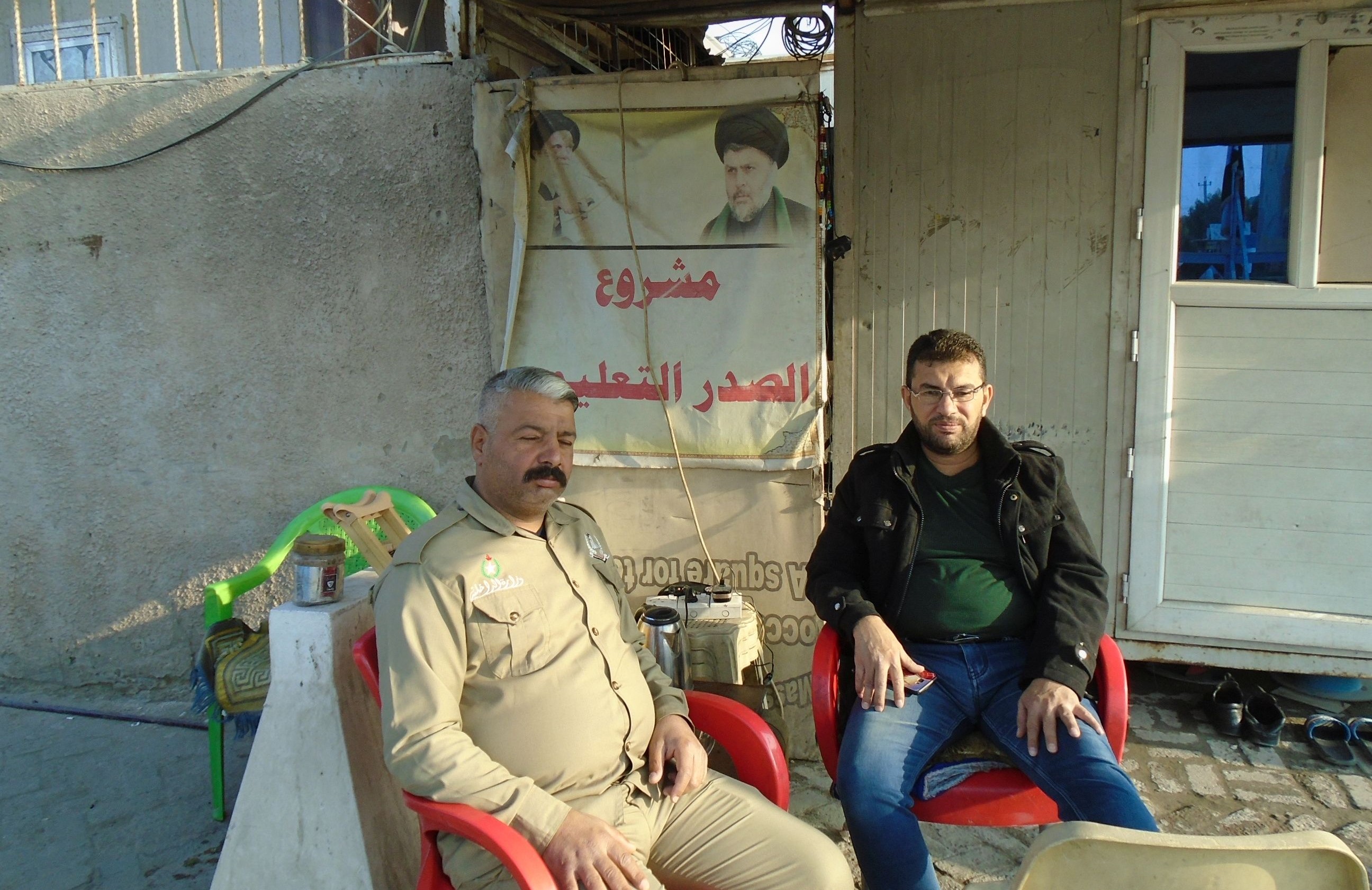 Security guards outside the Muqtada al-Sadr media centre (photo: Birgit Svensson)