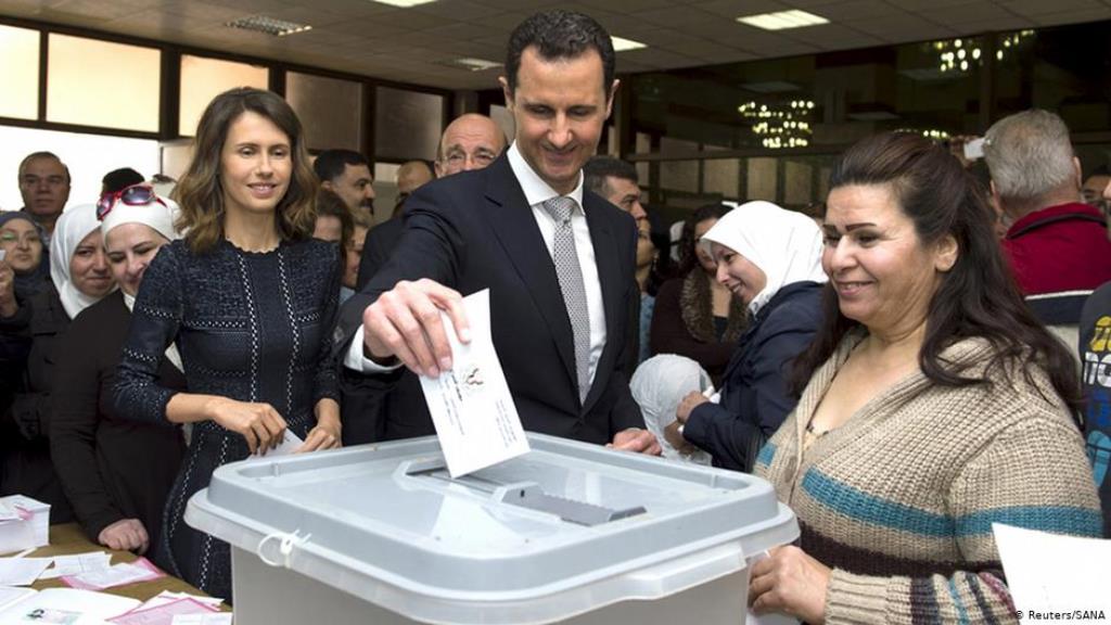 Syria's ruler, Bashar al-Assad, casts his vote during 2016 parliamentary elections, with his wife Asma on his left (photo: Reuters/SANA)