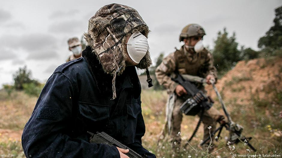  Mask-wearing GNA fighters in Libya (photo: Imago-Images/A. Salahuddien)