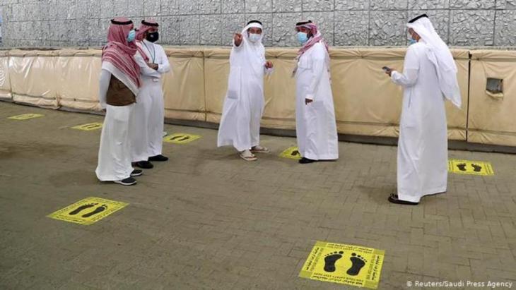 Saudi officials are seen where Muslim pilgrims will be allowed to stand to cast stones at pillars symbolising Satan (photo: Reuters/Saudi Press Agency)