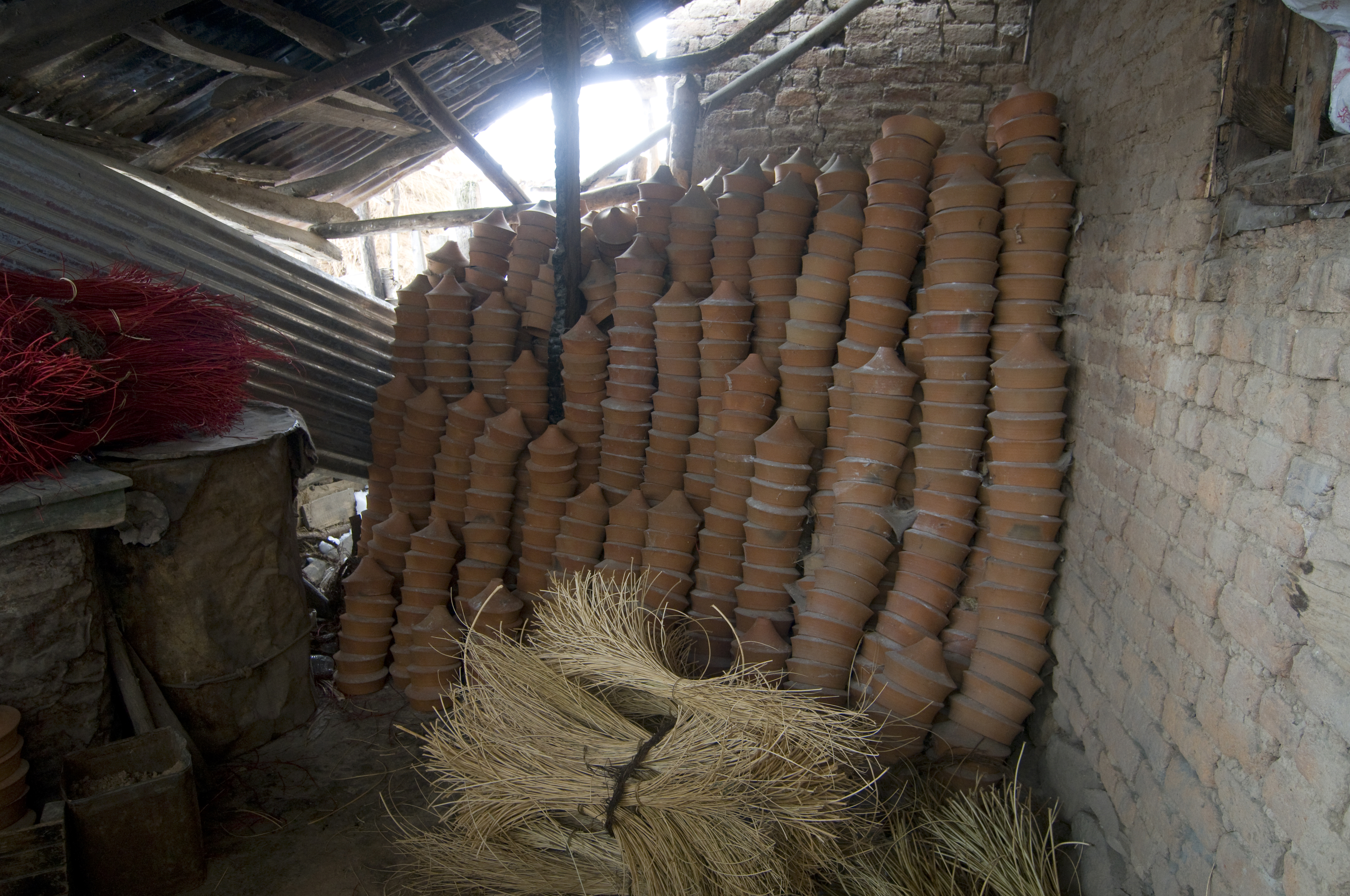 Earthenware kangdi pots stacked in the backroom of a Kashmir home (photo: Sugato Mukherjee)