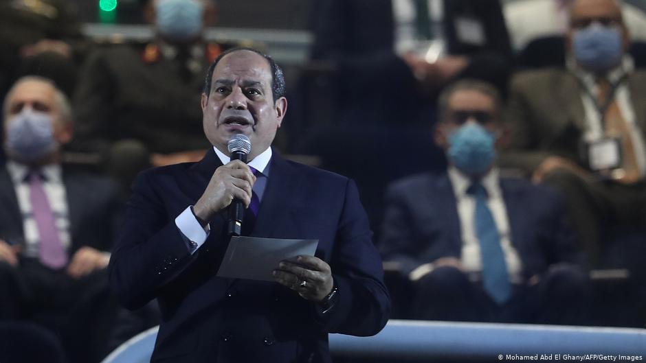 Egyptian president Abdeu Fattah al-Sisi (front) delivers a speech in grandstand before the opening match of the 2021 World Men's Handball Championship between Group G teams Egypt and Chile at the Cairo Stadium Sports Hall in the Egyptian capital on 13 January 2021 
