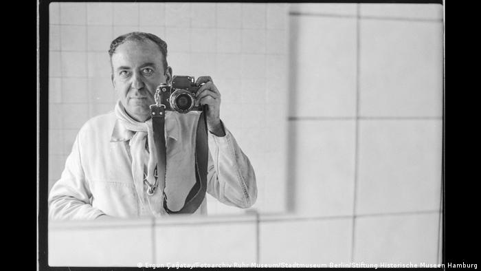Ergun Cagatay phographs himself in a mirror using a 35-mm camera. Photo from the exhibition "We are from here; German-Turkish life in 1990"