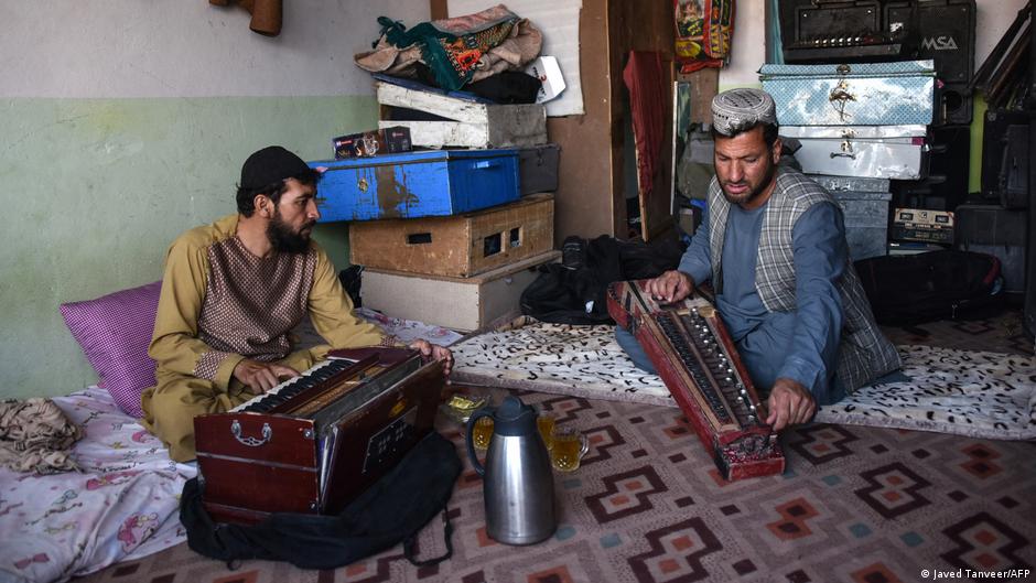 In this photo taken on 8 June 2021, professional musician Sayed Mohammad (R) rehearses with his japani, a traditional Central Asian stringed instrument, along with harmonium player Ghulam Mohammad at his music studio in Kandahar (photo: Javed Tanveer)